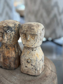 Houten geluksbeeldje met getuite lipjes