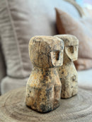 Houten geluksbeeldje met getuite lipjes