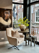 Draaifauteuil Bunda in lichte beige pluisjes stof met zwarte draaipoot