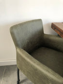 Eetkamerstoel Randy in groen PU-leder met skatewieltjes